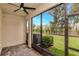 Screened-in patio with brick flooring offers views of the lawn at 4262 Cloud Hopper Way, Lutz, FL 33559