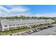 Overhead view of complex highlighting the red brick accents, green spaces, and ample parking at 4748 Azalea Dr # 204, New Port Richey, FL 34652