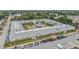 Aerial view of a multi-Gathering complex surrounding a courtyard with a pool and shuffleboard at 4748 Azalea Dr # 204, New Port Richey, FL 34652