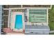Aerial view of the community pool, shuffleboard courts, and well-maintained grounds at 4748 Azalea Dr # 204, New Port Richey, FL 34652