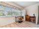 Bedroom area with laundry machine, window and desk space at 4748 Azalea Dr # 204, New Port Richey, FL 34652