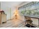 Bedroom area with desk, shelving, and closet at 4748 Azalea Dr # 204, New Port Richey, FL 34652