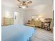 Cozy bedroom with neutral walls, wood look flooring, and rocking chair at 4748 Azalea Dr # 204, New Port Richey, FL 34652