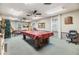 Game room featuring a pool table, comfortable seating, and ample lighting at 4748 Azalea Dr # 204, New Port Richey, FL 34652