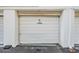 White garage door with '45 NO PARKING' displayed at 4748 Azalea Dr # 204, New Port Richey, FL 34652