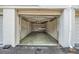 Spacious garage with concrete floor and workbench with lighting at 4748 Azalea Dr # 204, New Port Richey, FL 34652