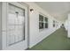Exterior hallway with front door and view of the community from the unit at 4748 Azalea Dr # 204, New Port Richey, FL 34652