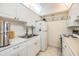 Efficient kitchen with bright cabinetry, essential appliances, and ample counter space, ideal for daily meal preparation at 4748 Azalea Dr # 204, New Port Richey, FL 34652