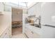 Bright kitchen featuring white cabinets, marble countertops, and a stainless steel faucet at 4748 Azalea Dr # 204, New Port Richey, FL 34652