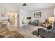 This open living room features sleek floors, natural light, and a seamless flow to the dining and kitchen areas at 4748 Azalea Dr # 204, New Port Richey, FL 34652