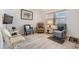 Comfortable living room with light floors, a window for natural light, and a cozy arrangement of seating at 4748 Azalea Dr # 204, New Port Richey, FL 34652