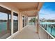 A large balcony with beautiful views of the water and the other condo buildings and docks at 530 S Gulfview Blvd # 203, Clearwater Beach, FL 33767