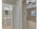 Bathroom with a vanity with a sink and mirror, adjacent to the bedroom at 530 S Gulfview Blvd # 203, Clearwater Beach, FL 33767
