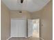 This is a bright bedroom featuring a double door closet and an open doorway to another room at 530 S Gulfview Blvd # 203, Clearwater Beach, FL 33767