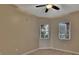 Comfortable bedroom featuring wood-look floors, neutral walls, and natural light from two windows at 530 S Gulfview Blvd # 203, Clearwater Beach, FL 33767