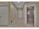Inviting foyer featuring neutral walls, tile flooring, and access to various rooms in the house at 530 S Gulfview Blvd # 203, Clearwater Beach, FL 33767