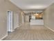 Open concept floorplan with living room, kitchen and dining area with tile floors and neutral colors at 530 S Gulfview Blvd # 203, Clearwater Beach, FL 33767
