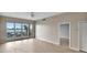 Inviting living room with access to a waterfront balcony with views and neutral color palette at 530 S Gulfview Blvd # 203, Clearwater Beach, FL 33767