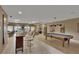 Spacious recreation room featuring a bar area, pool table, and comfortable seating with outside views at 530 S Gulfview Blvd # 203, Clearwater Beach, FL 33767