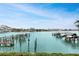 Wonderful waterfront view of the harbor with boat docks, boats, and beautiful clear blue skies above at 530 S Gulfview Blvd # 203, Clearwater Beach, FL 33767