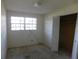 Bedroom featuring a bright window and closet with louvered doors at 5707 S 79Th St, Tampa, FL 33619