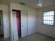 The bedroom features a ceiling fan, closet with louvered doors, and a window at 5707 S 79Th St, Tampa, FL 33619