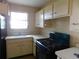 The kitchen has a sink under the window, and electric range at 5707 S 79Th St, Tampa, FL 33619
