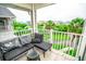 Relaxing balcony with patio seating and views of tropical landscaping at 5712 Biscayne Ct # 201, New Port Richey, FL 34652