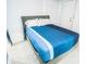 Cozy bedroom featuring a comfortable bed and stylish bedside furniture at 5712 Biscayne Ct # 201, New Port Richey, FL 34652