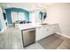 Modern kitchen featuring white cabinets, stainless steel appliances, and an open layout at 5712 Biscayne Ct # 201, New Port Richey, FL 34652