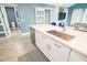 Bright kitchen with island, stainless sink, and sliding doors for easy access at 5712 Biscayne Ct # 201, New Port Richey, FL 34652
