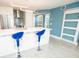 Bright kitchen features modern appliances and easy access to a sliding door at 5712 Biscayne Ct # 201, New Port Richey, FL 34652