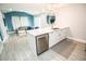 Open concept kitchen with modern appliances, a white countertop island and living room in the background at 5712 Biscayne Ct # 201, New Port Richey, FL 34652