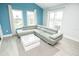 Cozy living room featuring a stylish sectional sofa and bright natural lighting at 5712 Biscayne Ct # 201, New Port Richey, FL 34652