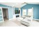 Bright living room featuring stylish lighting, built-ins, and comfortable seating at 5712 Biscayne Ct # 201, New Port Richey, FL 34652