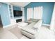 Spacious living room with built-in shelves, fireplace, and comfortable seating at 5712 Biscayne Ct # 201, New Port Richey, FL 34652