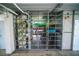 Storage cage filled with a kayak, paddleboard, bicycle and household items at 5712 Biscayne Ct # 201, New Port Richey, FL 34652