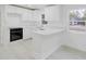 Bright, renovated kitchen with modern appliances, white cabinets, countertops, and ample counter space at 5801 N 17Th St, Tampa, FL 33610
