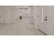 Open floor plan showing the front door, and kitchen complete with modern appliances, countertops, and sink at 5801 N 17Th St, Tampa, FL 33610