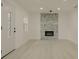 Bright living room featuring recessed lighting, wood floors, and a modern electric fireplace at 5801 N 17Th St, Tampa, FL 33610