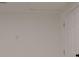 This vacant room features light gray flooring, white walls and trim, and a white door at 5801 N 17Th St, Tampa, FL 33610