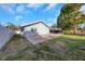 Backyard patio with access to the pool and a view of the property's side at 605 Citrus Ct, Largo, FL 33770