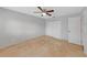Bedroom featuring a ceiling fan and double closet doors at 605 Citrus Ct, Largo, FL 33770