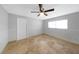 Light-filled bedroom with tile flooring and a bright window at 605 Citrus Ct, Largo, FL 33770