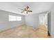 Neutral bedroom with a ceiling fan and tile floor at 605 Citrus Ct, Largo, FL 33770