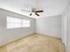 Neutral bedroom with a ceiling fan and tile floor at 605 Citrus Ct, Largo, FL 33770