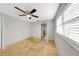 Cozy bedroom with a ceiling fan and tile floor at 605 Citrus Ct, Largo, FL 33770