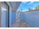 Enclosed courtyard featuring brick pavers and a decorative white metal gate at 605 Citrus Ct, Largo, FL 33770