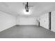 Clean garage with painted floor, two doors and mechanicals on walls, and an automatic opener at 605 Citrus Ct, Largo, FL 33770