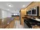 Modern kitchen with granite counters, stainless steel appliances, and spacious layout at 605 Citrus Ct, Largo, FL 33770